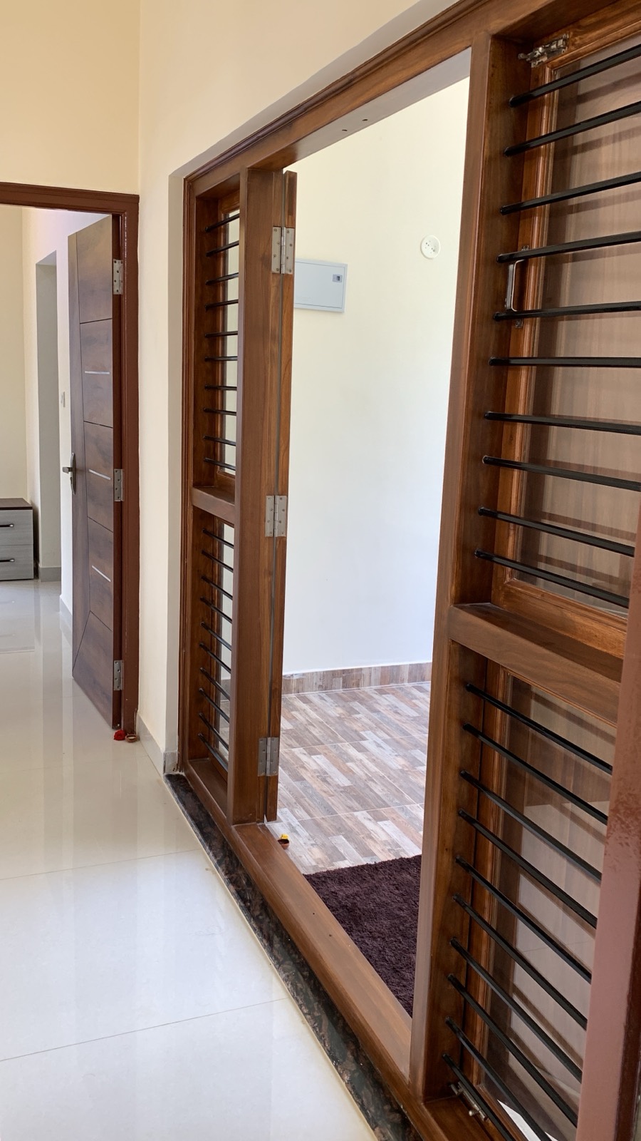 Teak-framed doors and windows with steel grills, Sarjapur home, Bangalore